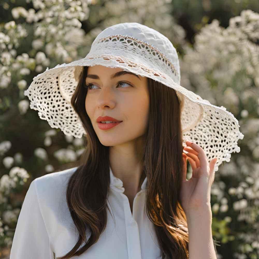 A hat with romantic lace detailing adds a soft, feminine touch.